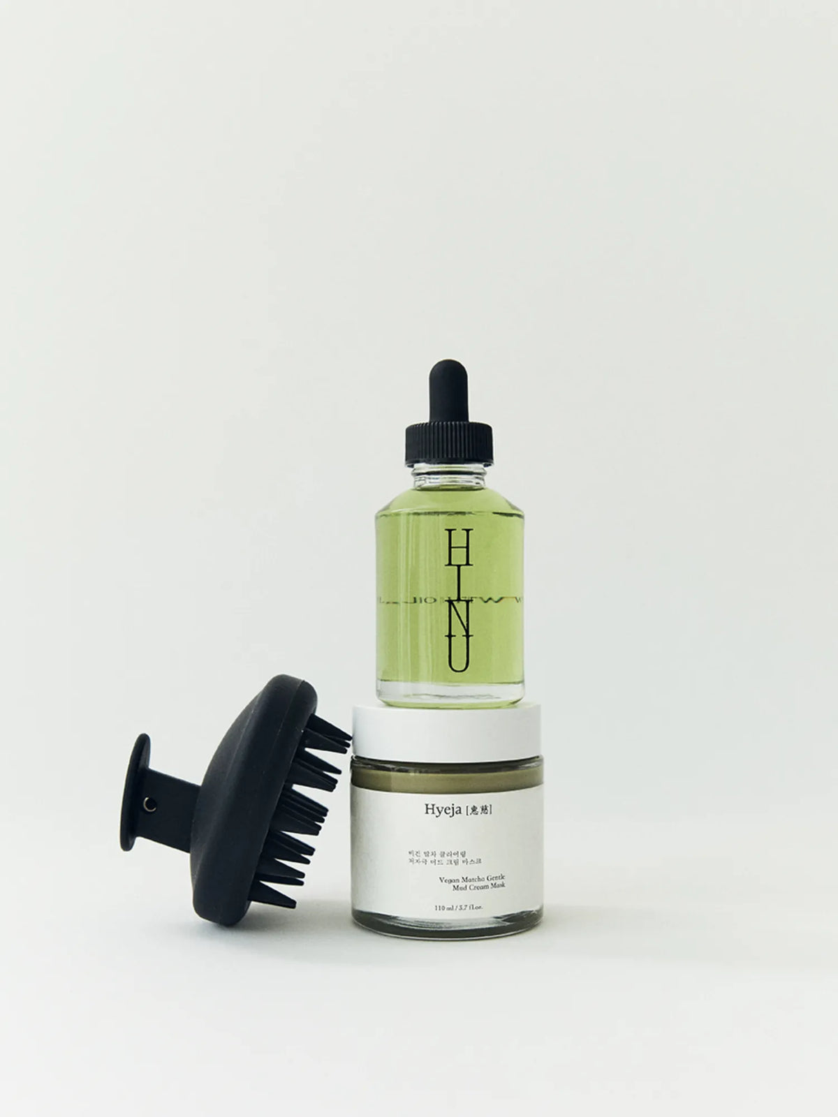HINU Hair Growth Oil, Matcha Mask and Scalp Massager stacked together
