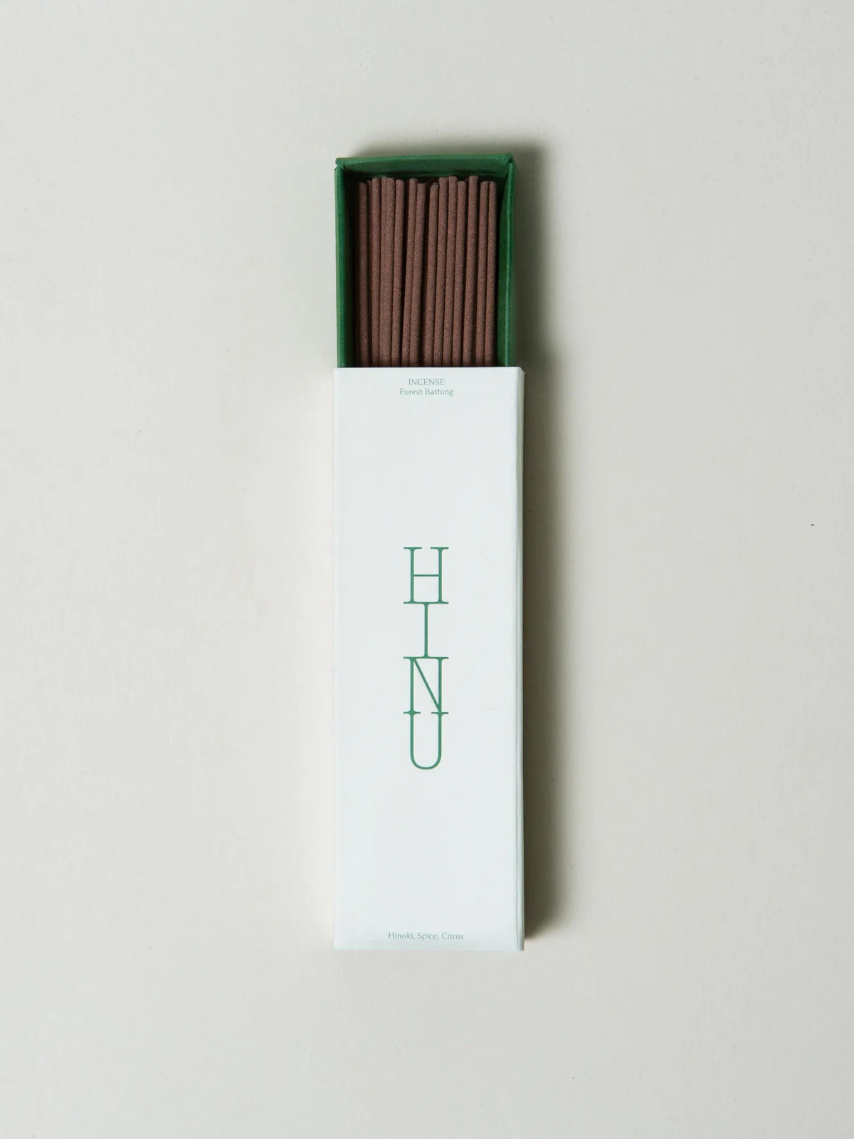 Open HINU Forest Bathing Incense box with brown sticks on white