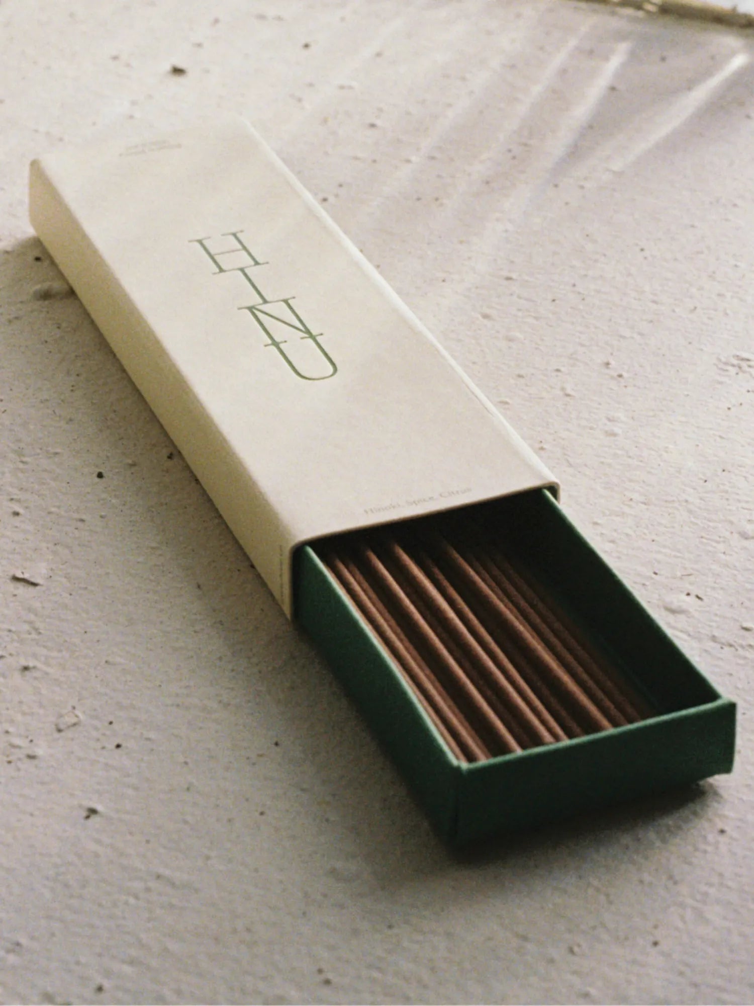 Open HINU Forest Bathing Incense box showing brown sticks