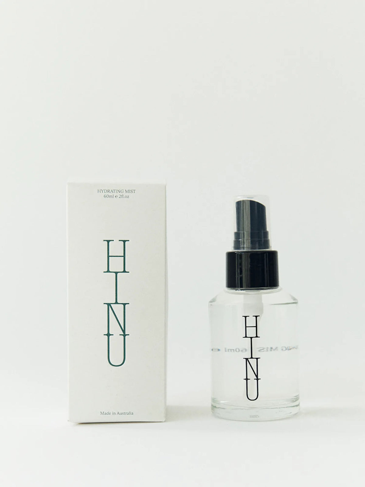HINU Hydrating Mist bottle beside its white product box