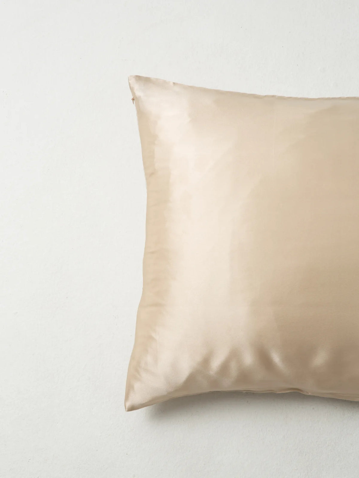 Close-up of the oat-coloured HINU Hair Protect Pillowcase