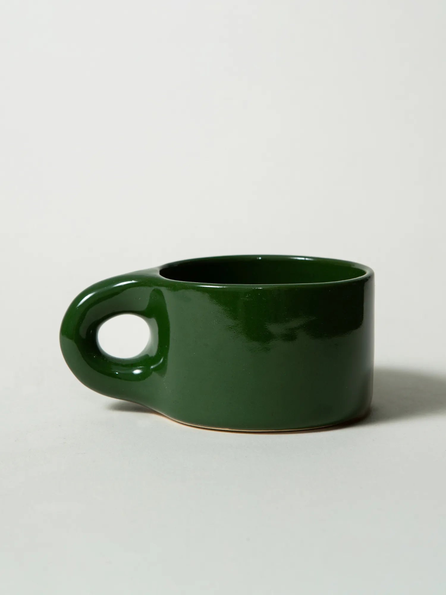 Side view of the handcrafted green HINU Ritual Mug