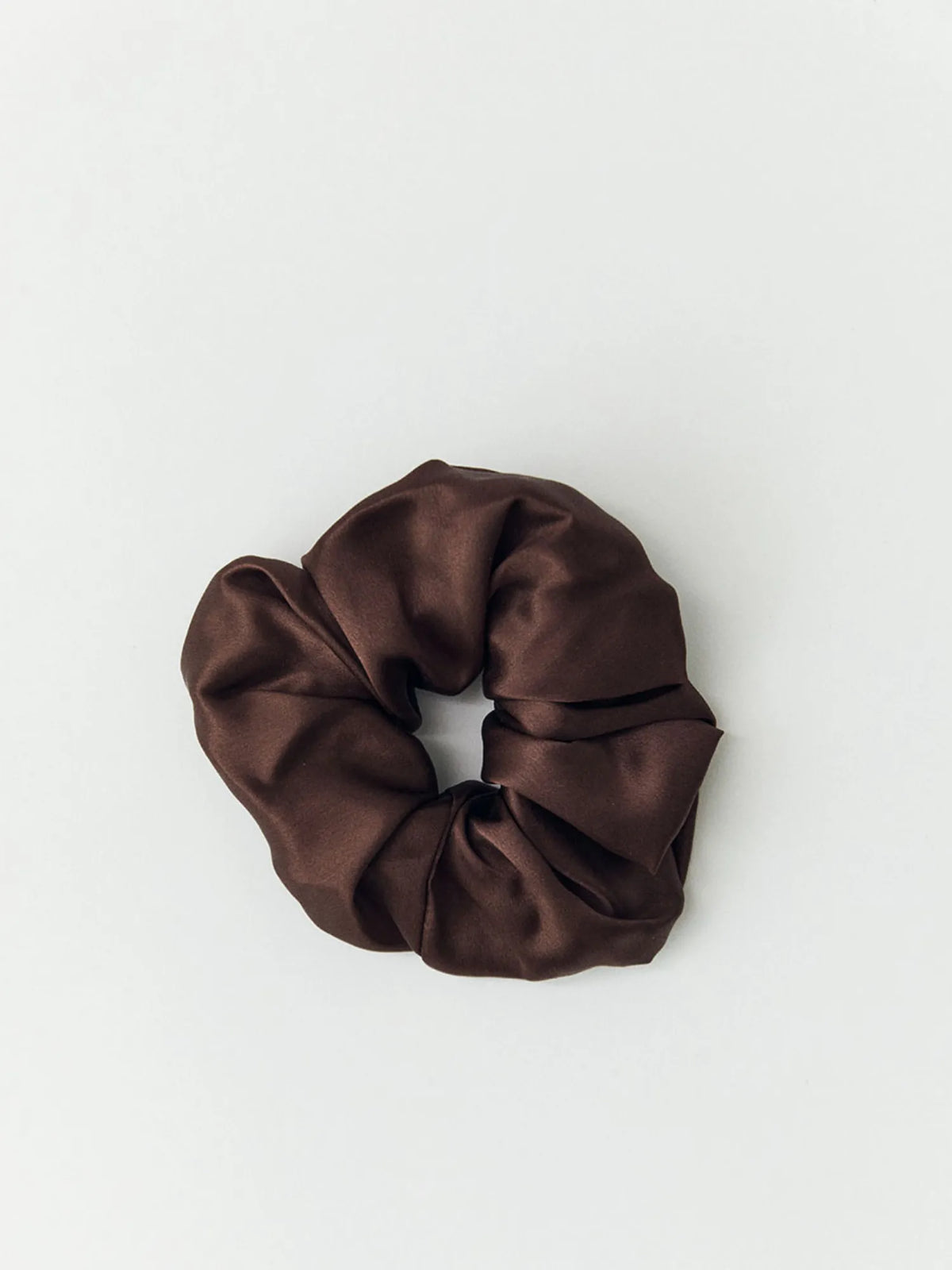Brown HINU Silk Scrunchie on an off-white background