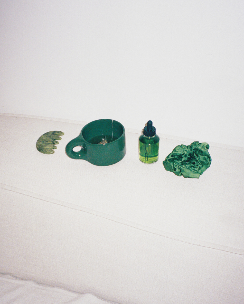 HINU Ritual Kit products arranged on white seating