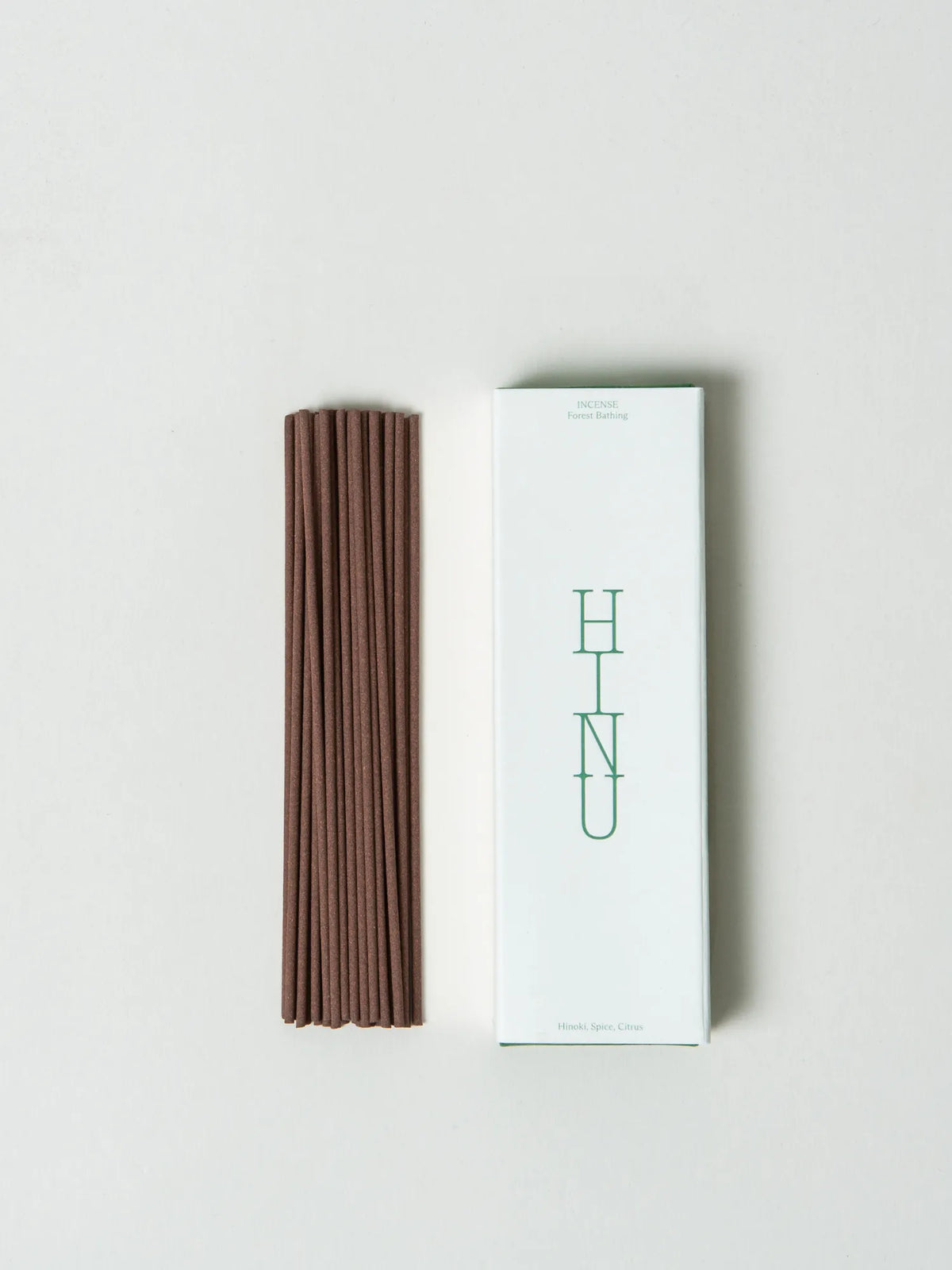 Brown Forest Bathing incense sticks arranged beside the HINU box