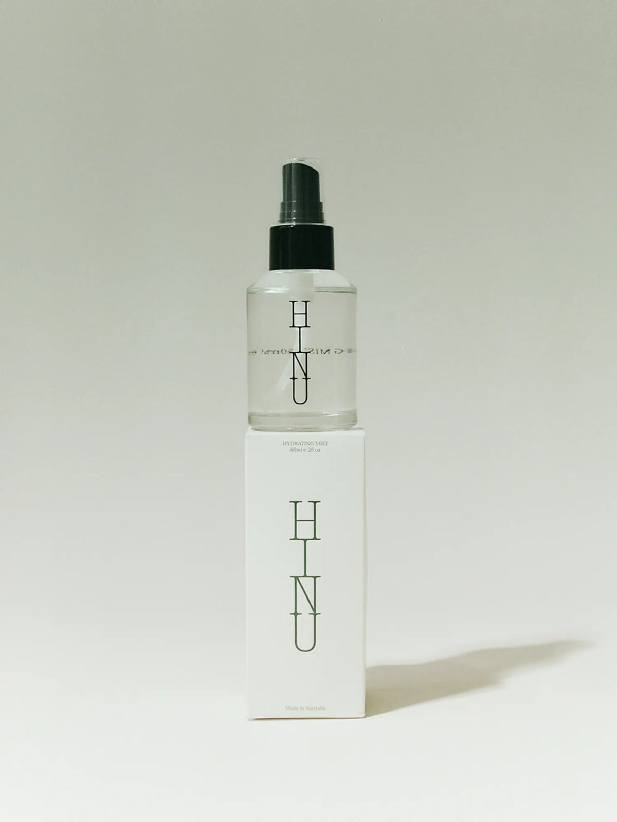 HINU Hydrating Mist bottle displayed on top of its white box