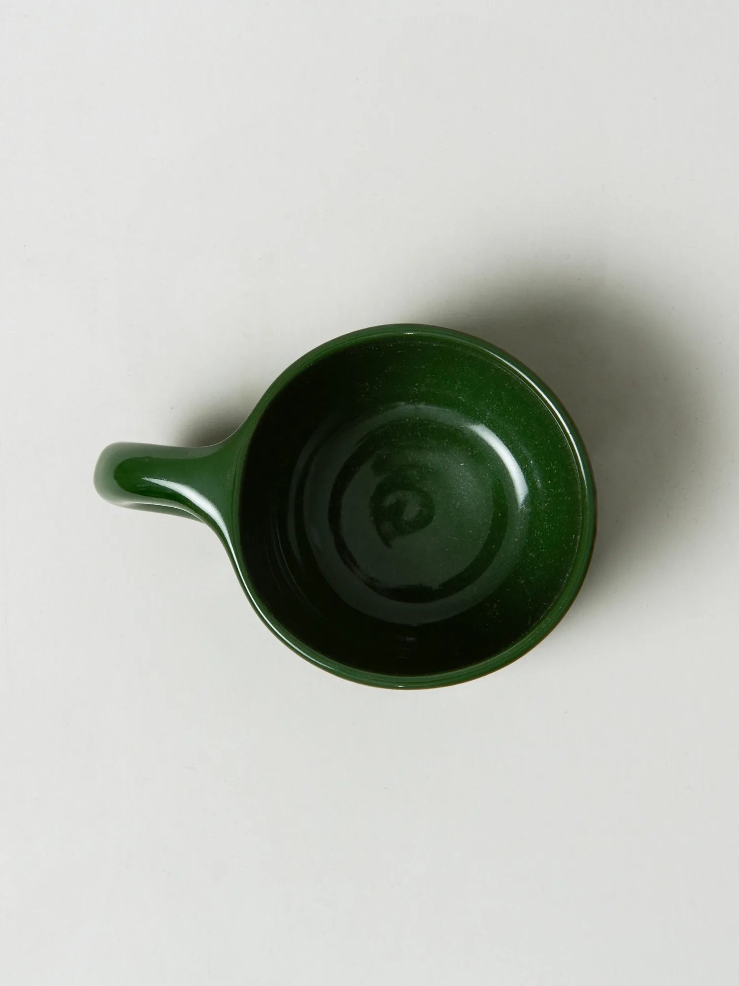 Overhead view inside the empty green HINU Ritual Mug